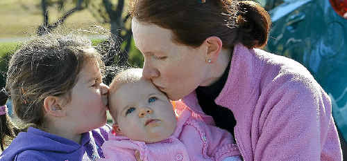 WARWICK mum Marguerite Walsh doesn’t have to be asked twice to kiss her little daughters Erin, 5, and baby Rose (six months) in celebration of World Kissing Day. WARWICK mum Marguerite Walsh doesn’t have to be asked twice to kiss her little daughters Erin, 5, and baby Rose (six months) in celebration of World Kissing Day.